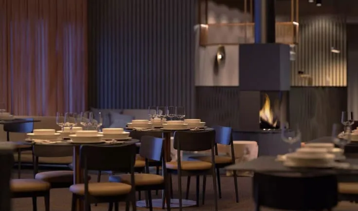 The restaurant: dark round tables laid with stacked white bowls and wine glasses, curved dining chairs, a fireplace and a fluted timber wall behind.