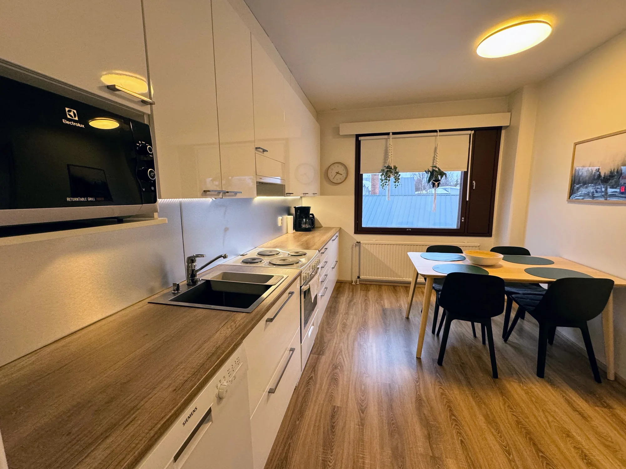 The kitchen and dining table of the Aurora Suite.