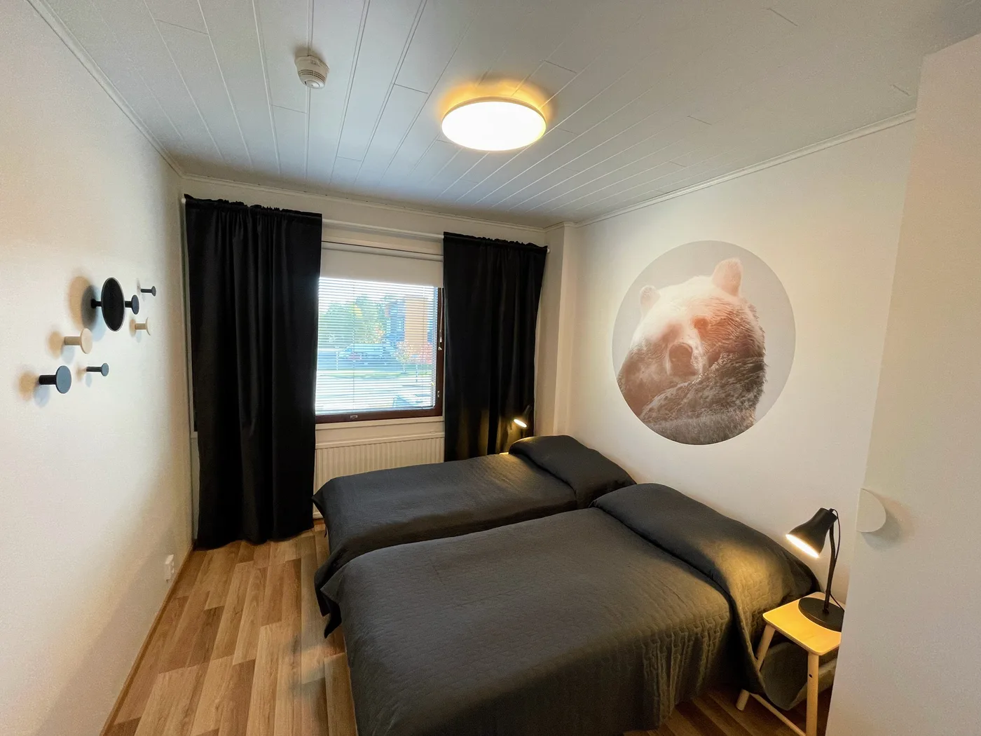 A bear painted on the bedroom wall of Bear's Nest, above the bed.
