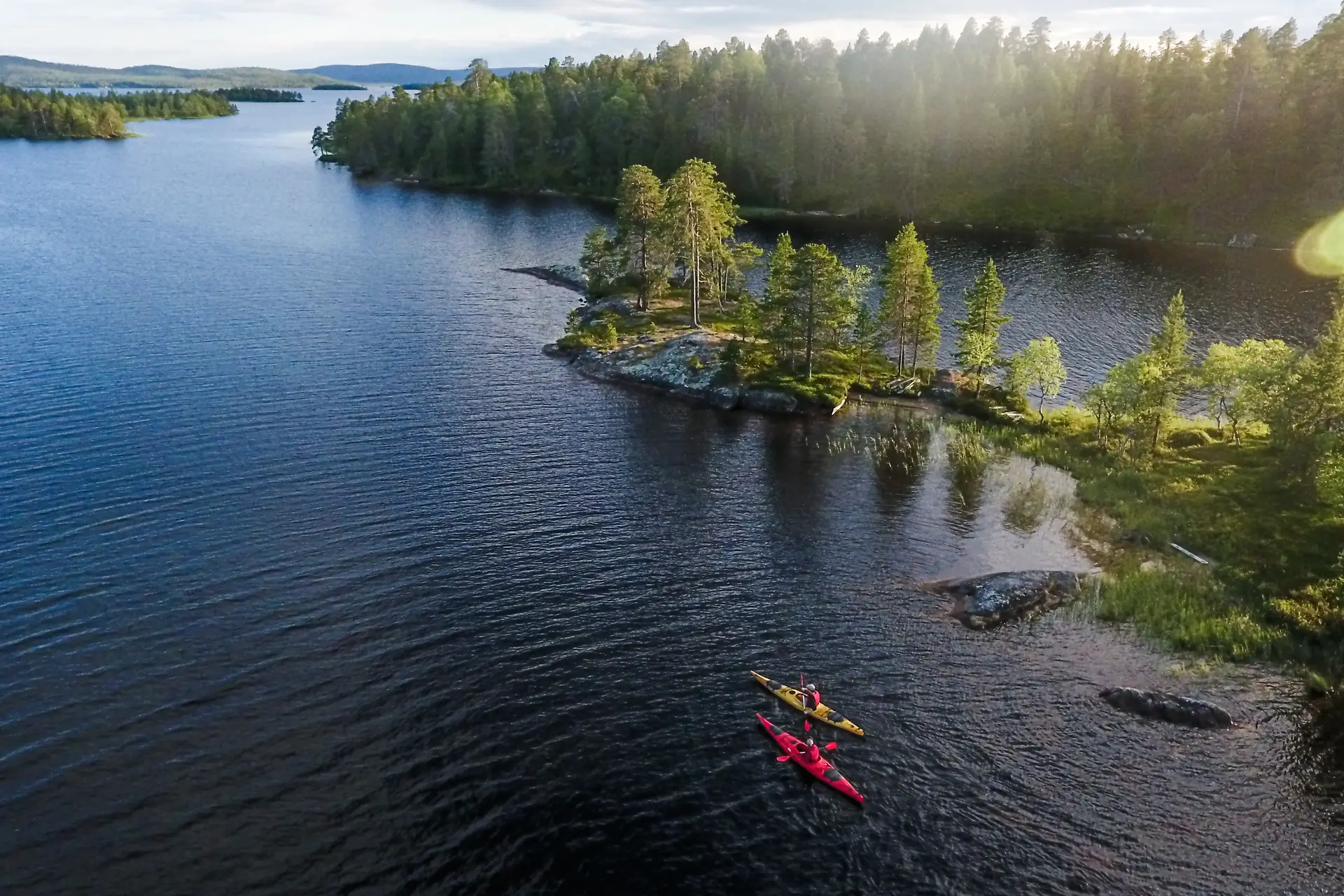 Golden hour aerial view of kayaking